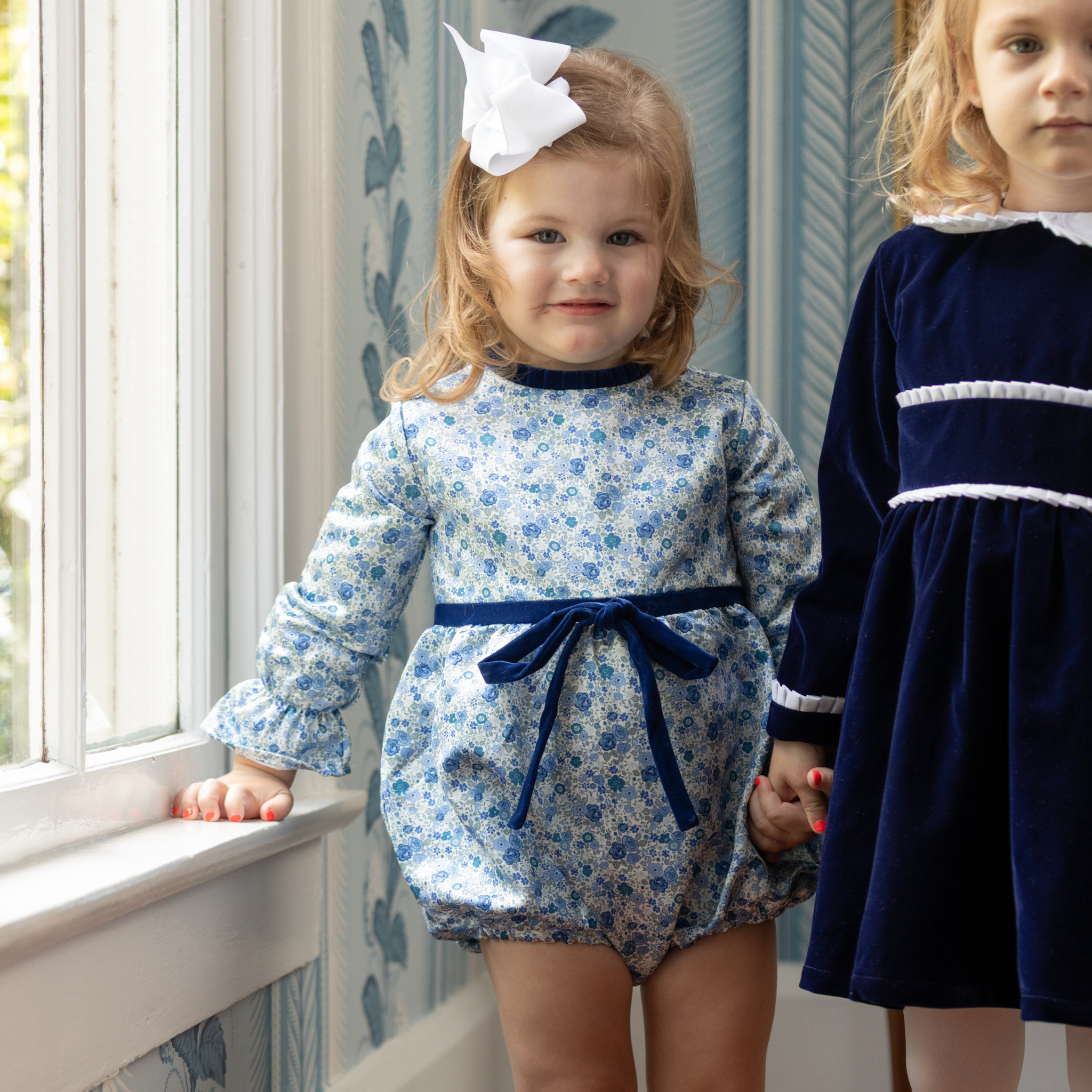 Henry Duvall Hazel Bubble in Prescott Petals floral with Back Bay Blue Velvet bow, classic baby girl fall romper designed to coordinate with sibling and mommy styles