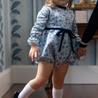 Henry Duvall Hazel Bubble in Prescott Petals floral with Back Bay Blue Velvet bow, classic baby girl fall romper designed to coordinate with sibling and mommy styles