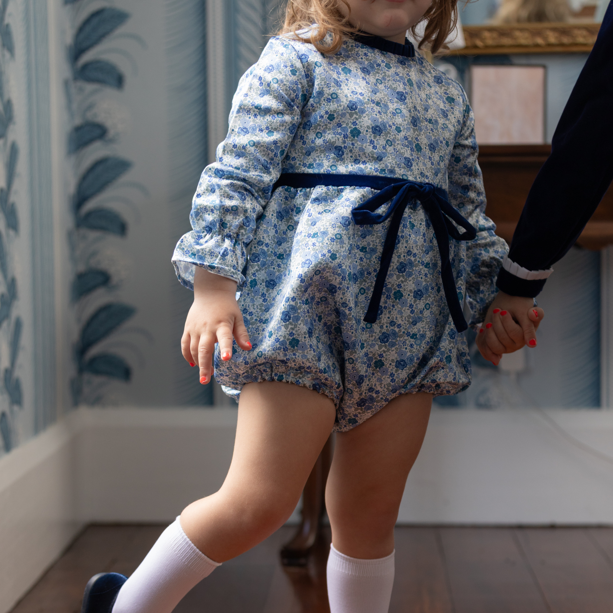 Henry Duvall Hazel Bubble in Prescott Petals floral with Back Bay Blue Velvet bow, classic baby girl fall romper designed to coordinate with sibling and mommy styles