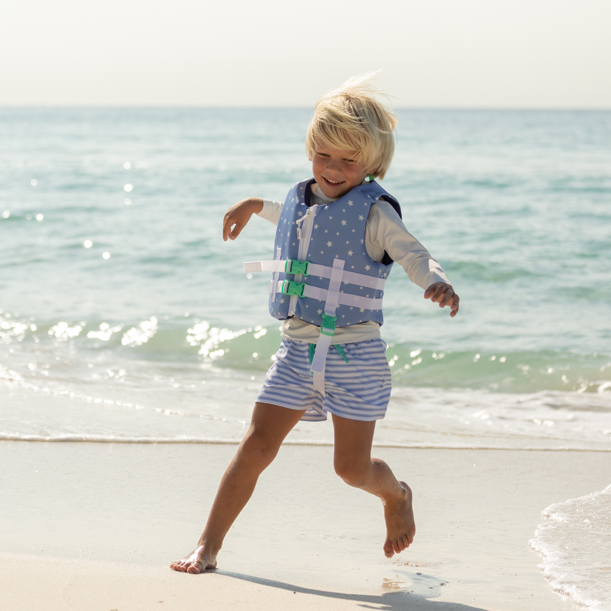 Stylish Henry Duvall x Line + Cleat kids life jacket in blue star print with zipper front and adjustable safety straps
