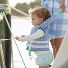 Stylish Henry Duvall x Line + Cleat infant life jacket in blue star print with neck pillow support, zipper front, and adjustable straps