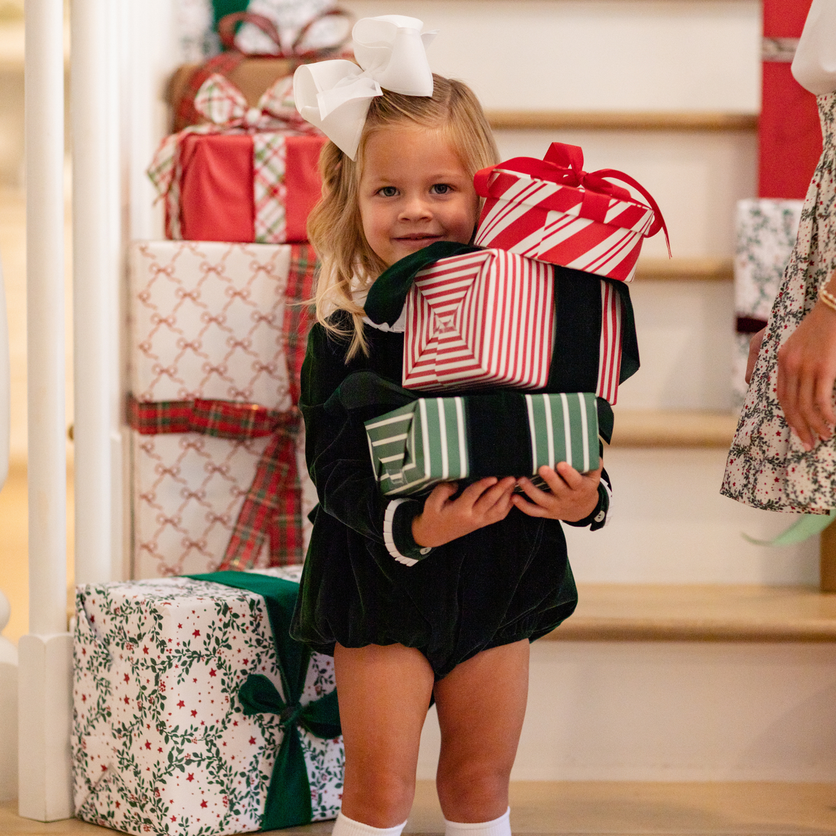 Baby girls’ Long Sleeve Grace Bubble in Grafton Green Velvet with a white pleated collar, waist and cuff trim.