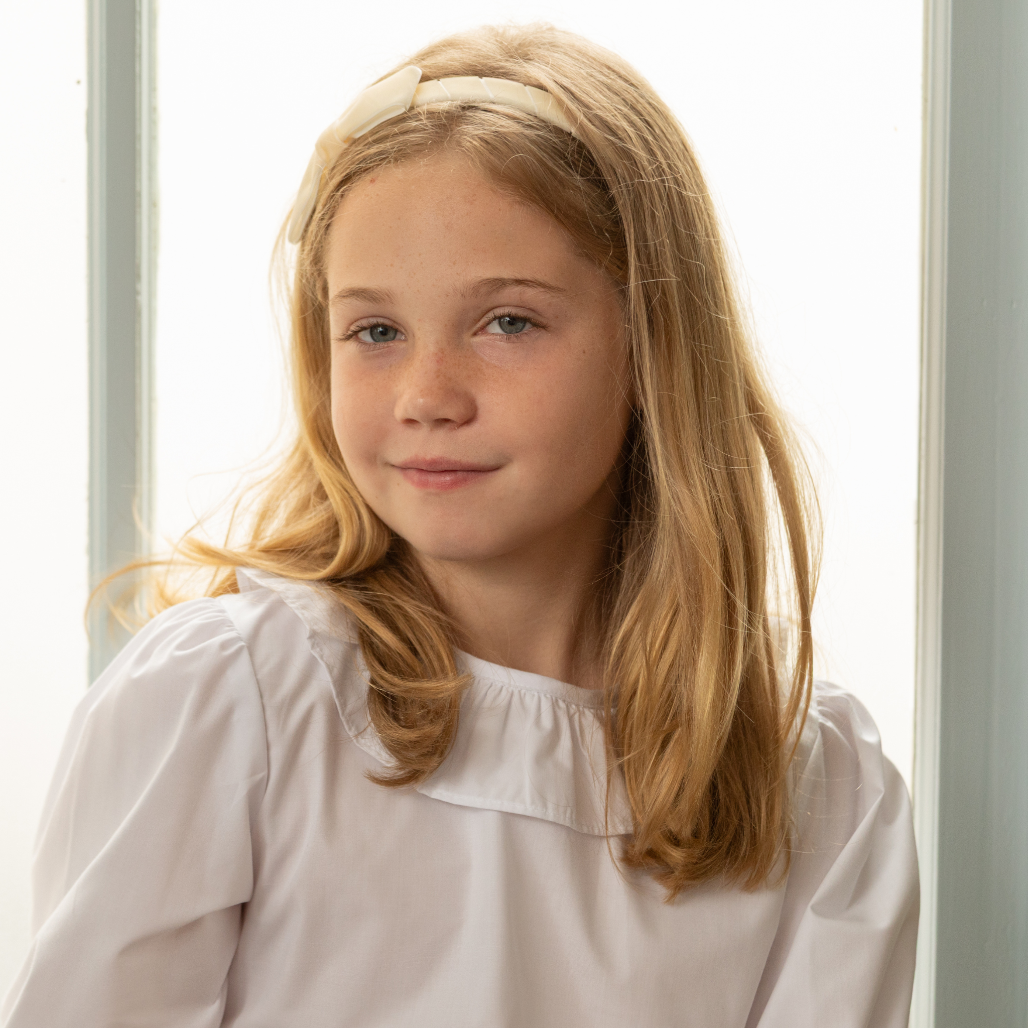 Henry Duvall Ruthie Ruffled Blouse for girls in Classic White, featuring a ruffle collar, long sleeves, and ruffled cuffs for fall and winter layering.