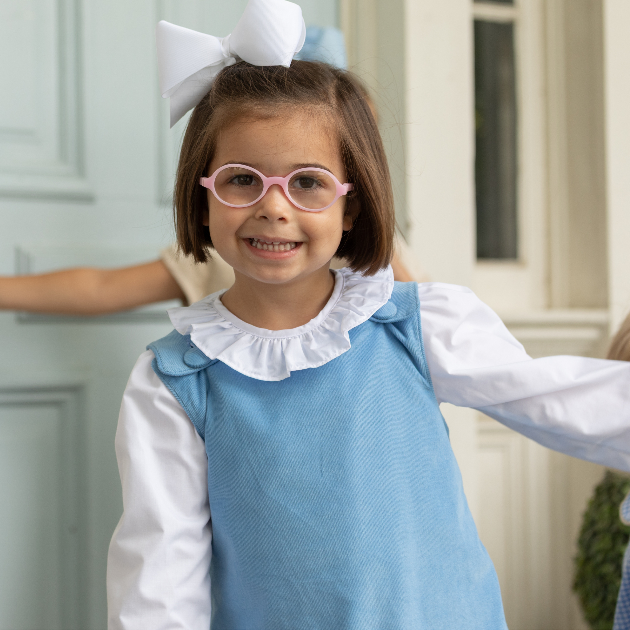 Henry Duvall Ruthie Ruffled Blouse for girls in Classic White, featuring a ruffle collar, long sleeves, and ruffled cuffs for fall and winter layering.