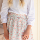 Henry Duvall Ruthie Ruffled Blouse for girls in Classic White, featuring a ruffle collar, long sleeves, and ruffled cuffs for fall and winter layering.