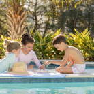 Classic boys’ swim trunks by Henry Duvall in a tailored above-the-knee fit with UPF 50+ protection, featuring an elastic waistband and drawstring for a comfortable summer look.