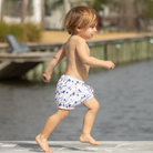 Henry Duvall baby swim shorties in red white and blue star print, patriotic UPF 50+ baby swim bloomers for Memorial Day, 4th of July, beach vacations, and summer wear