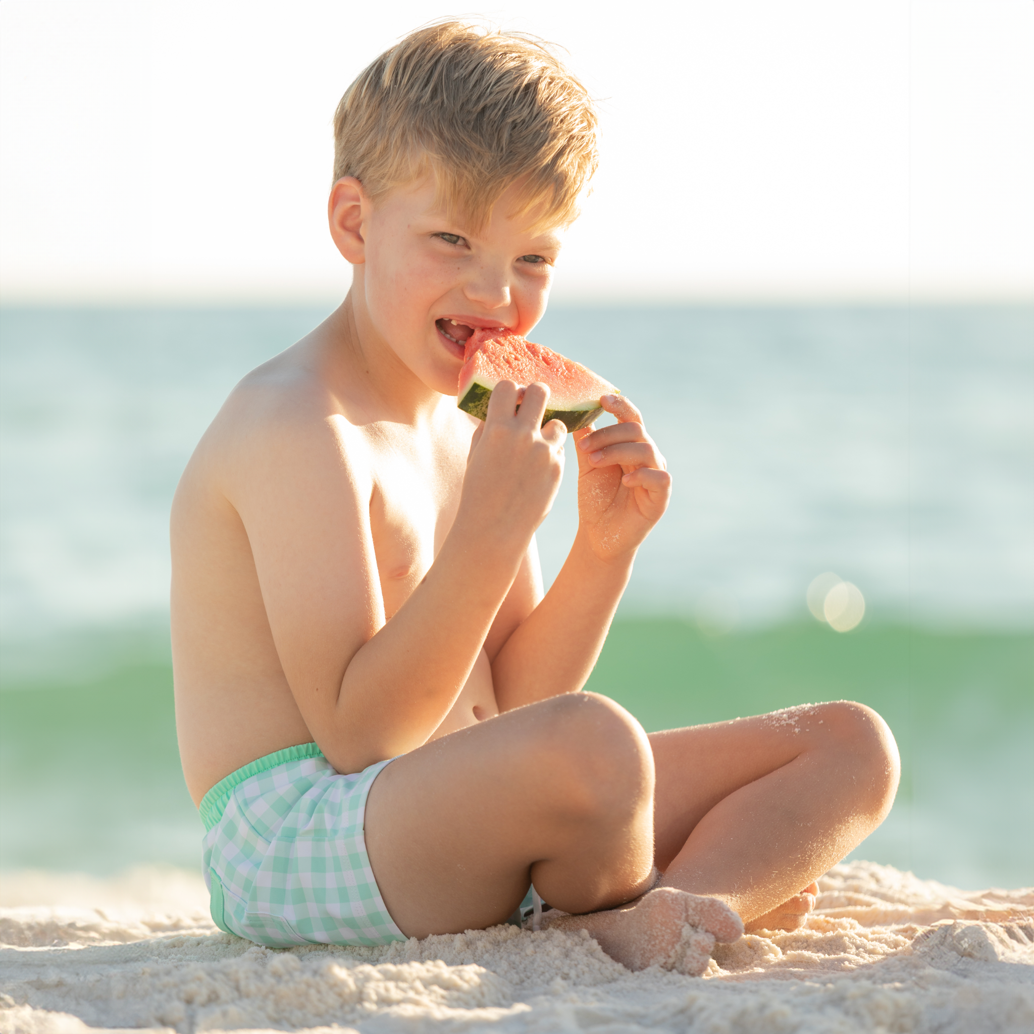 Classic boys’ swim trunks by Henry Duvall in a tailored above-the-knee fit with UPF 50+ protection, featuring an elastic waistband and drawstring for a comfortable summer look.