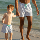 Classic boys’ swim trunks by Henry Duvall in a tailored above-the-knee fit with UPF 50+ protection, featuring an elastic waistband and drawstring for a comfortable summer look.