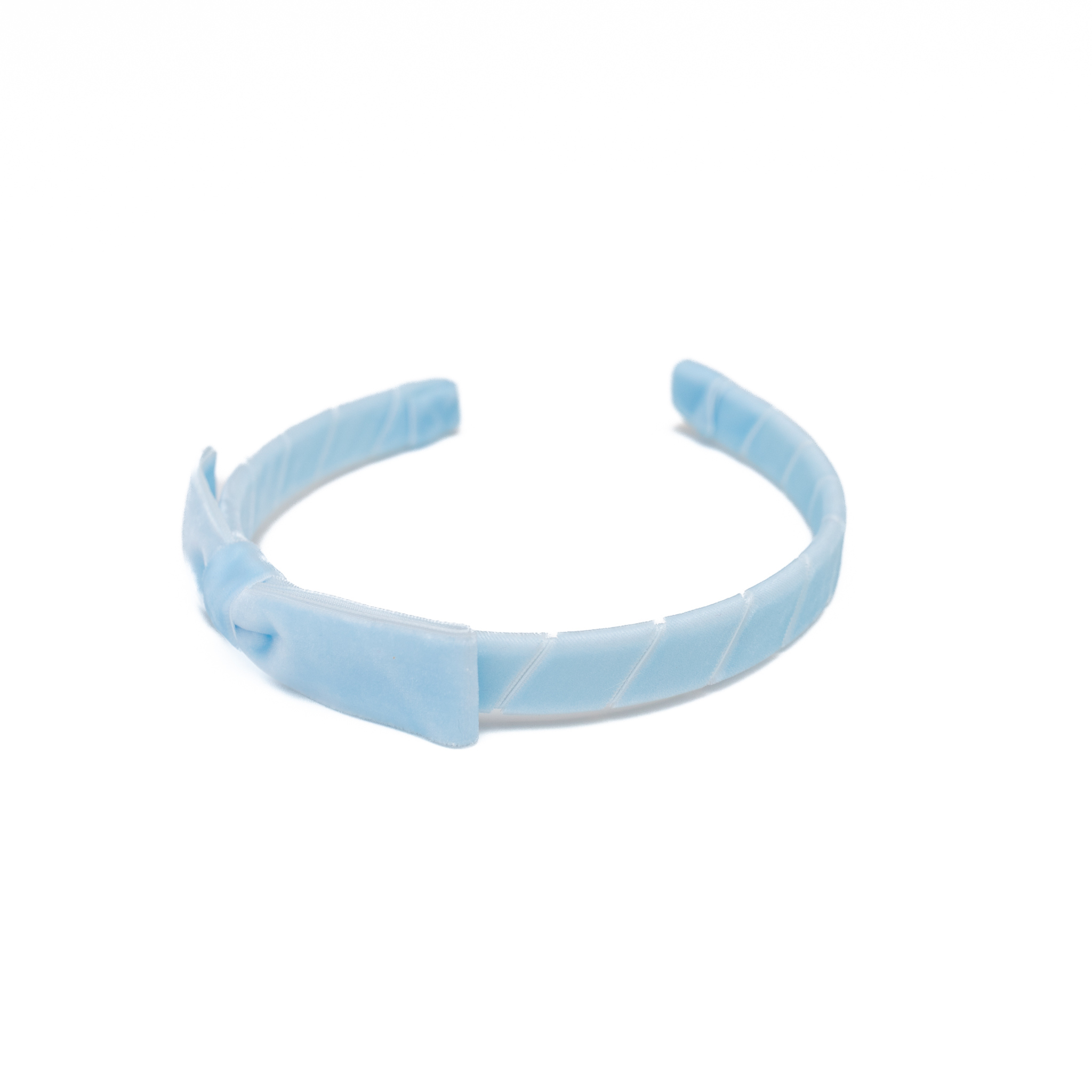 A timeless finishing touch, the Velvet Lottie Headband by Winn & William is a classic accessory designed to elevate any fall ensemble. Hand-wrapped and handcrafted in Dallas, Texas, this velvet headband features a perfectly proportioned bow and a soft, structured shape that’s as comfortable as it is charming.