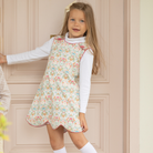 Henry Duvall Janie Jumper girls’ dress in Fall Floral with scalloped hem and fabric-covered shoulder buttons, designed for layering with blouses and turtlenecks for fall.
