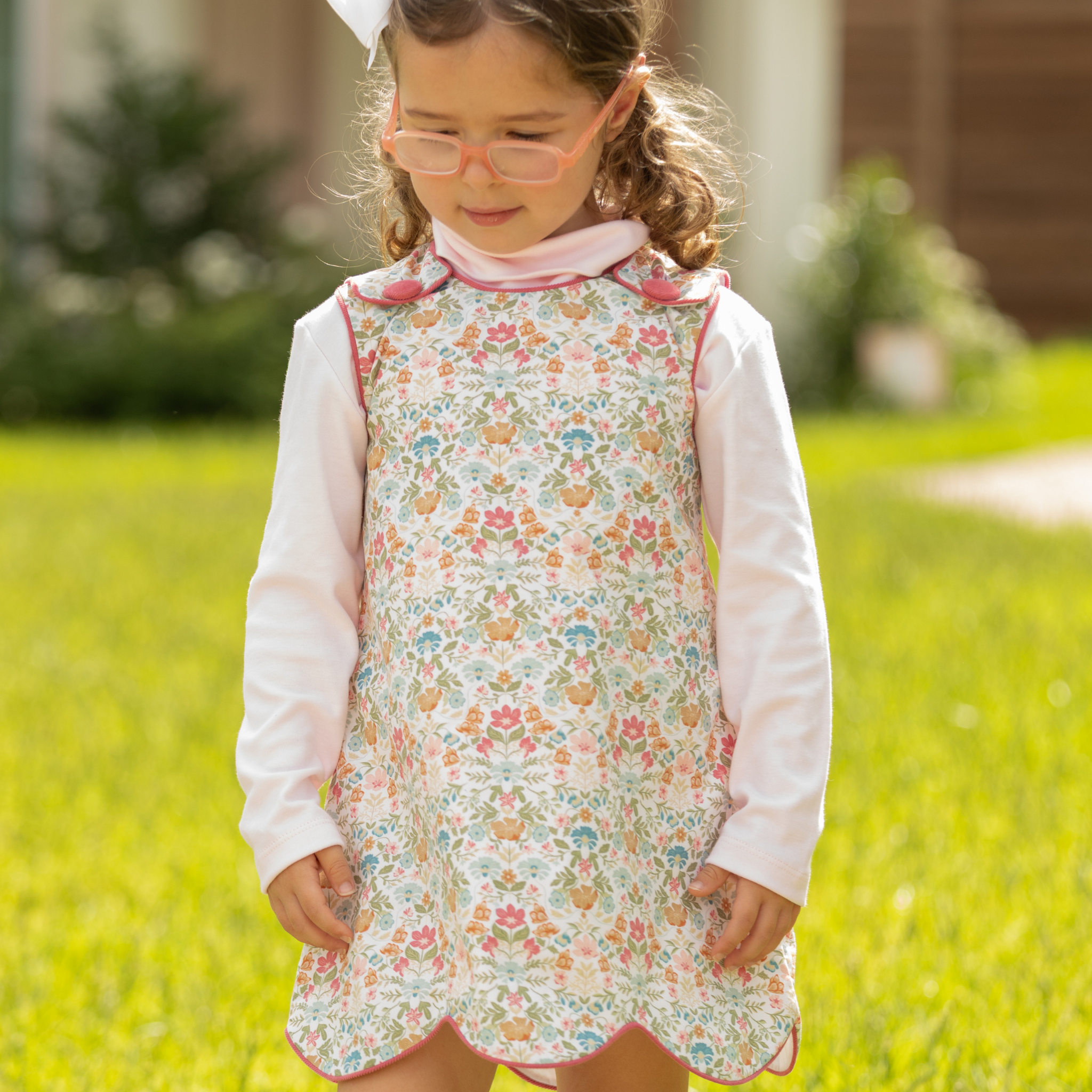 Henry Duvall Janie Jumper girls’ dress in Fall Floral with scalloped hem and fabric-covered shoulder buttons, designed for layering with blouses and turtlenecks for fall.
