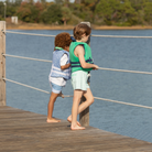 Classic boys’ swim trunks by Henry Duvall in a tailored above-the-knee fit with UPF 50+ protection, featuring an elastic waistband and drawstring for a comfortable summer look.