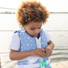 Stylish Henry Duvall x Line + Cleat kids life jacket in blue star print with zipper front and adjustable safety straps