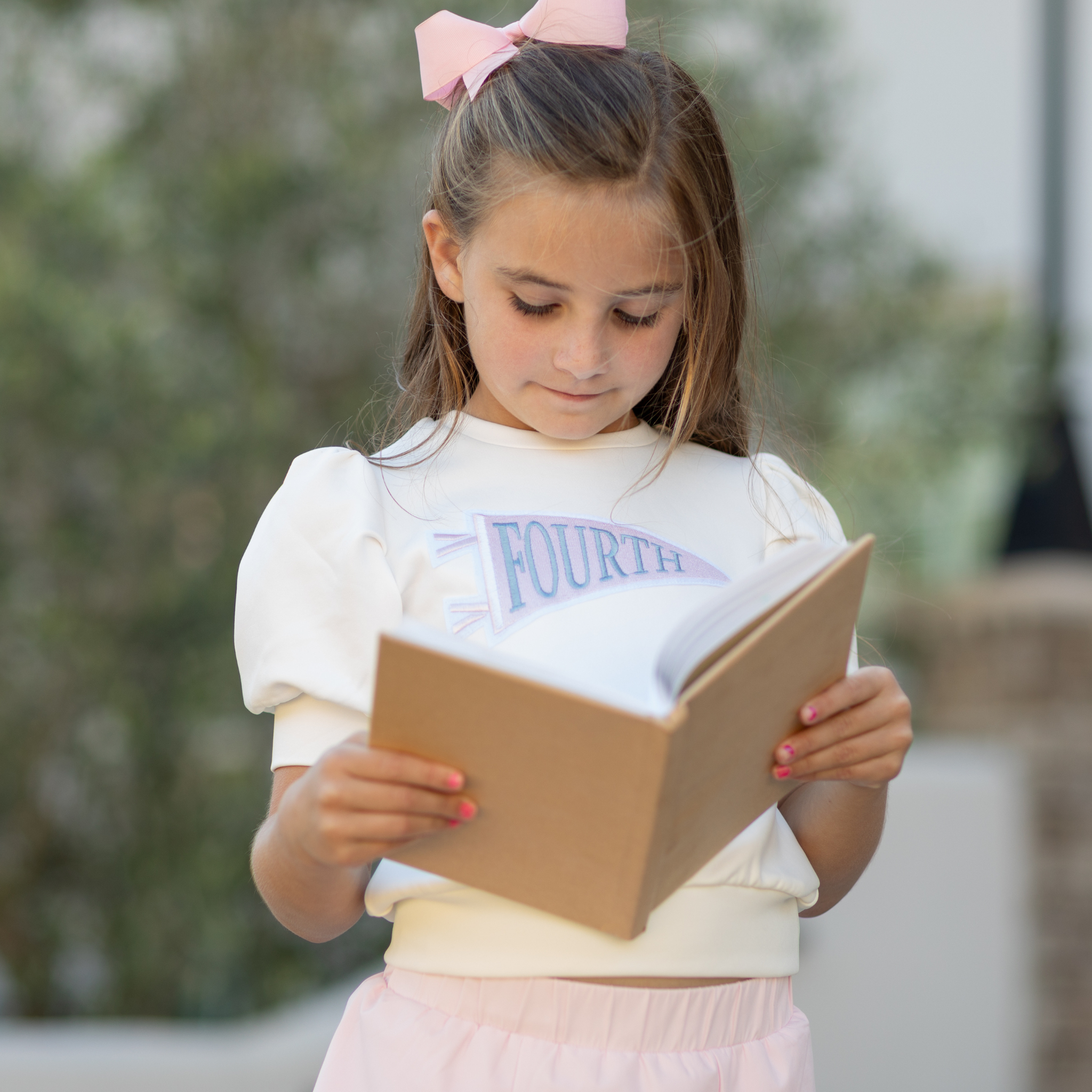 Henry Duvall Pennant Tee featuring appliqué grade pennant, classic back-to-school shirt for kindergarten through fifth grade, perfect for first day of school photos and school milestone celebrations.
