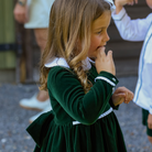 Baby girls’ Long Sleeve Grace Bubble in Grafton Green Velvet with a white pleated collar, waist and cuff trim.