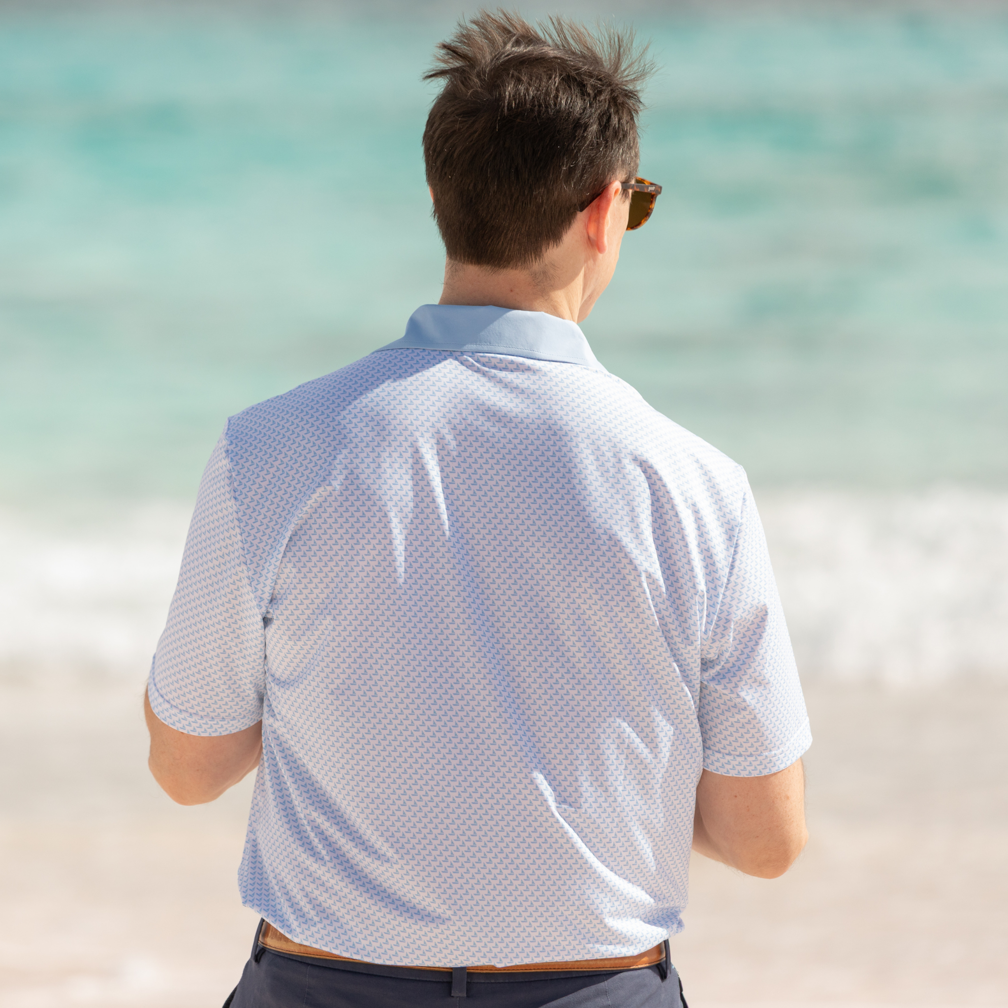 Henry Duvall men’s performance polo in breathable stretch fabric, classic preppy short sleeve polo shirt for golf, work, and everyday wear.