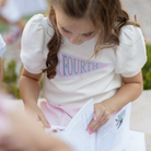 Henry Duvall Pennant Tee featuring appliqué grade pennant, classic back-to-school shirt for kindergarten through fifth grade, perfect for first day of school photos and school milestone celebrations.