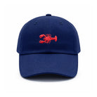 Blue cap with a red lobster emblem on a white background