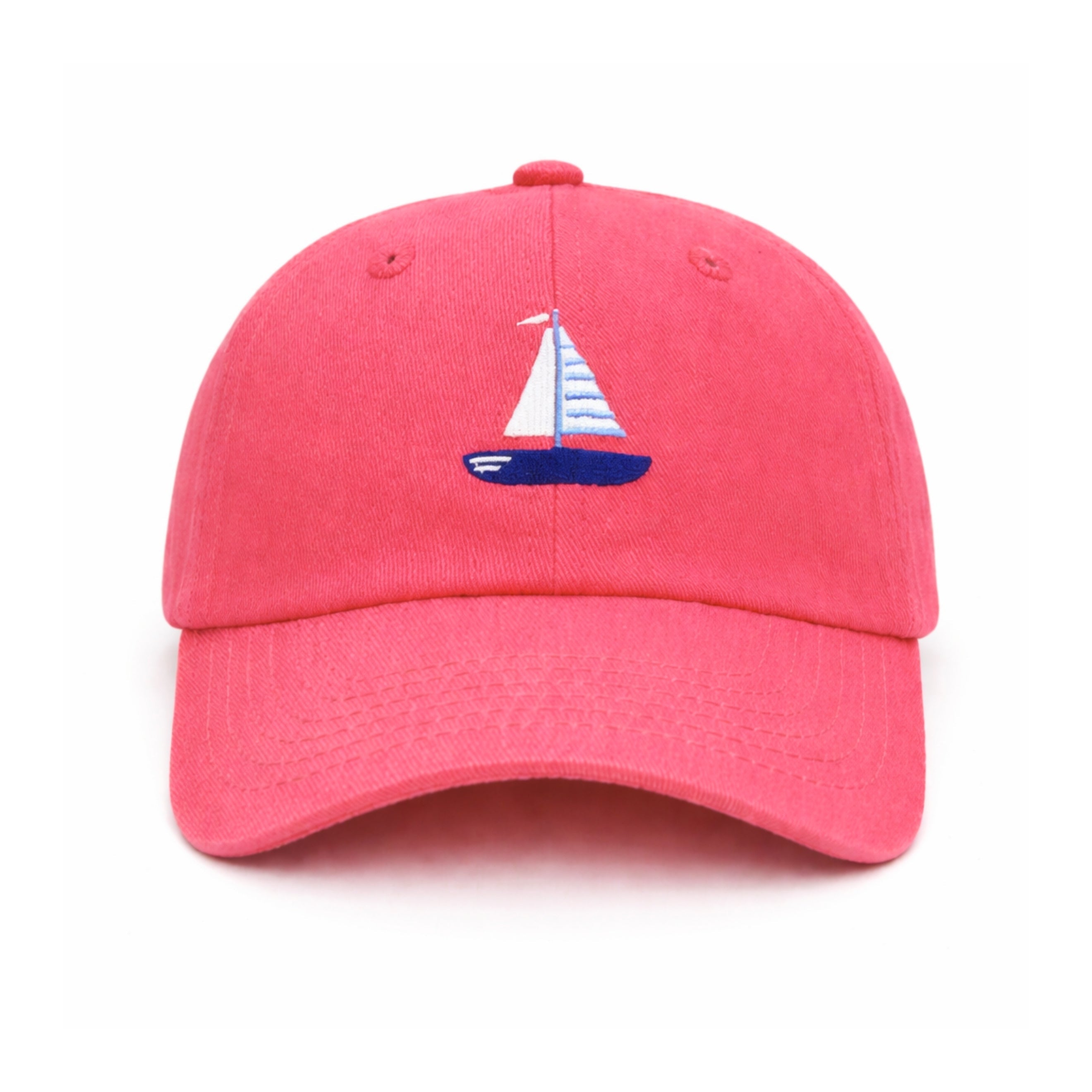 Pink cap with a sailboat emblem on a white background