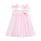 Henry Duvall Daisy Dress in blush pink cotton with hand-smocked crayon embroidery and shoulder bow ties, classic girls back-to-school dress for first day of school photos and fall occasions.