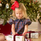 Girls’ Beatrice Bubble in navy, red, and green Tinsel Tartan with subtle metallic thread, Midnight Blue Corduroy scalloped collar, and scalloped sleeve trim.