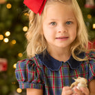 Girls’ Beatrice Bubble in navy, red, and green Tinsel Tartan with subtle metallic thread, Midnight Blue Corduroy scalloped collar, and scalloped sleeve trim.