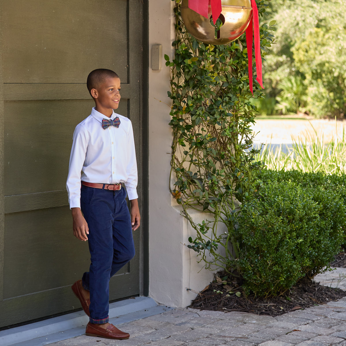 Boys’ pre-tied Baker Bow Tie in navy, red, and green Tinsel Tartan with subtle metallic thread and easy-on clasp.