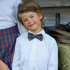Boys’ pre-tied Baker Bow Tie in navy, red, and green Tinsel Tartan with subtle metallic thread and easy-on clasp.