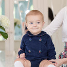 Baby boys’ Banks Bubble in Midnight Blue Corduroy with Tinsel Tartan-covered buttons and coordinating plaid trim at the Peter Pan collar and cuffs.