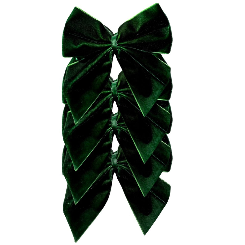 Green velvet bow on a white background