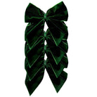 Green velvet bow on a white background