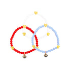 Three beaded bracelets in red, white, and blue on a light gray background
