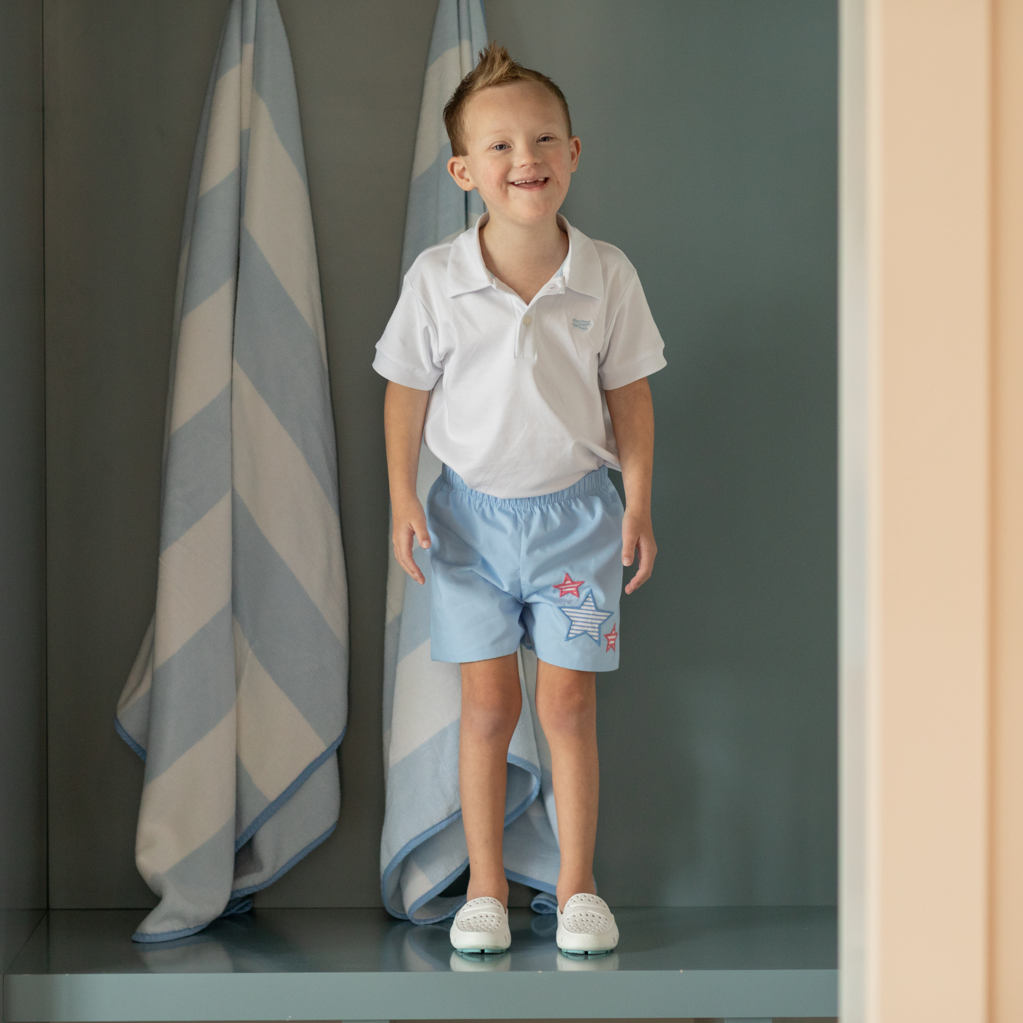 Henry Duvall Liam boys shorts in blue with red white and blue star embroidery, classic preppy patriotic shorts for Memorial Day, 4th of July, and summer wear