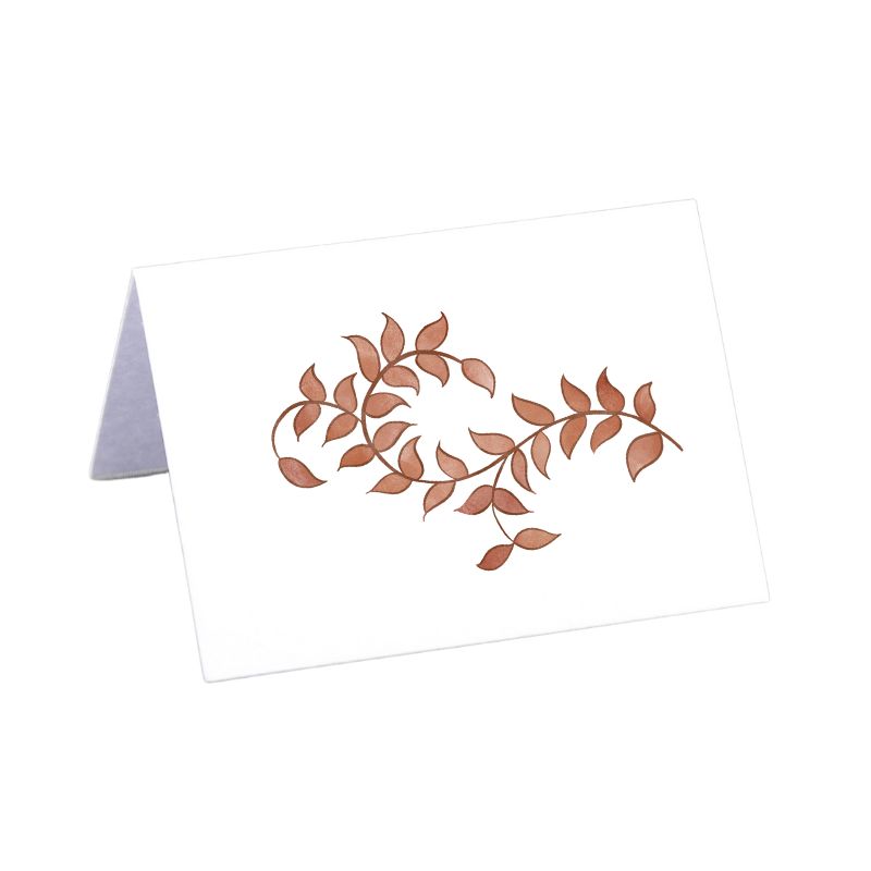 Folded tent-style Thanksgiving place cards with brown woodland leaf motif, matching fall tablecloths and Thanksgiving tabletop decor