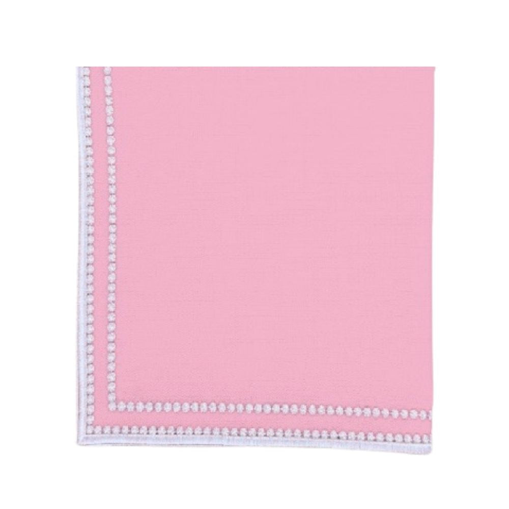 Pink napkin with white trim on a white background