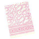Pink and white patterned fabric on a white background