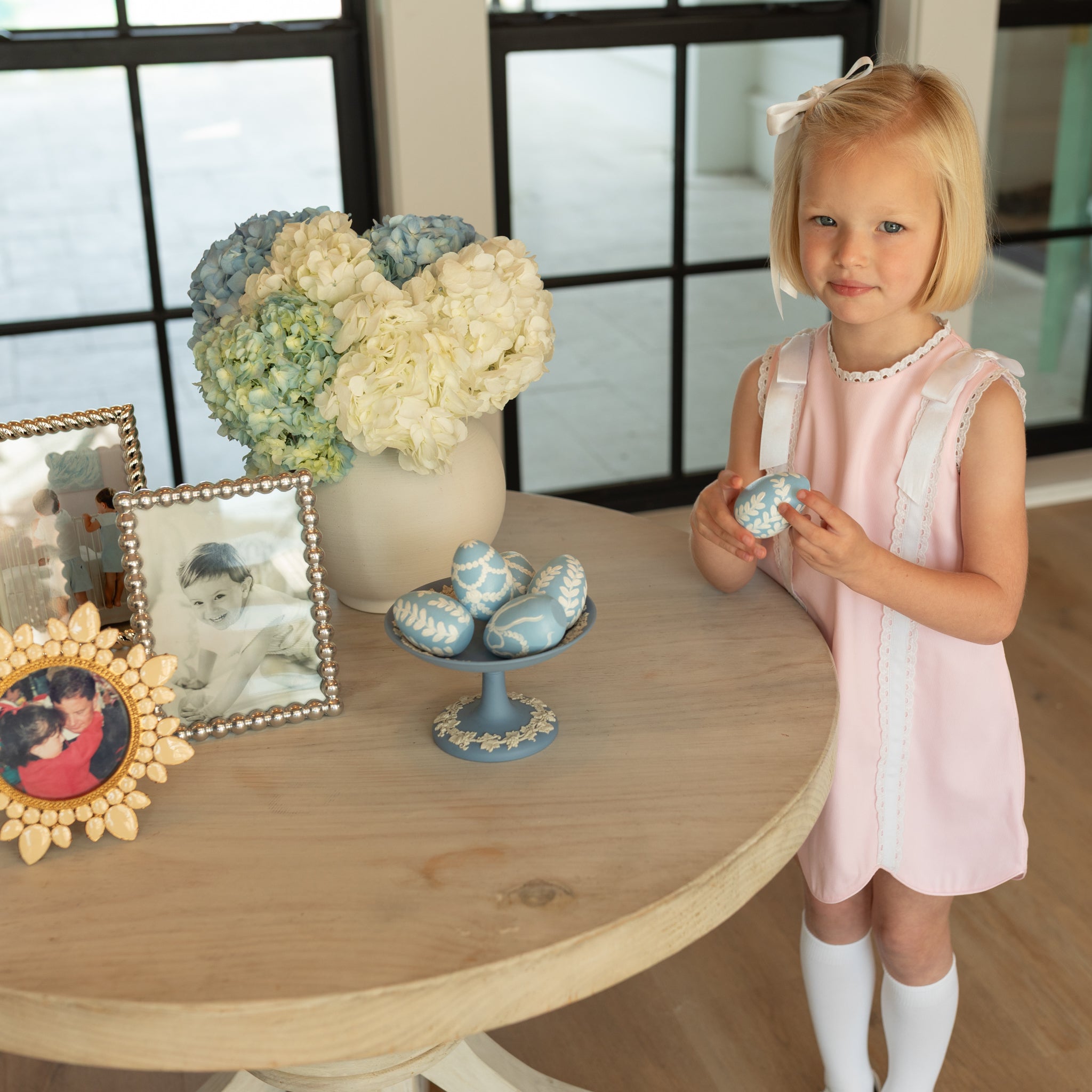 Girl wearing the Henry Duvall Rosie Dress, a classic pink girls dress designed for spring celebrations and family portraits.
