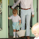 Boy wearing the Henry Duvall Bradford Trousers, a polished boys trouser styled for spring occasions and sibling coordination.