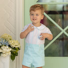 Toddler boy wearing the Henry Duvall Benjamin Button-On, a traditional heirloom-style outfit designed for special occasions and family photos.