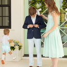 Boy wearing the Henry Duvall Bradford Trousers, a polished boys trouser styled for spring occasions and sibling coordination.