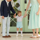 Boy wearing the Henry Duvall Bradford Trousers, a polished boys trouser styled for spring occasions and sibling coordination.