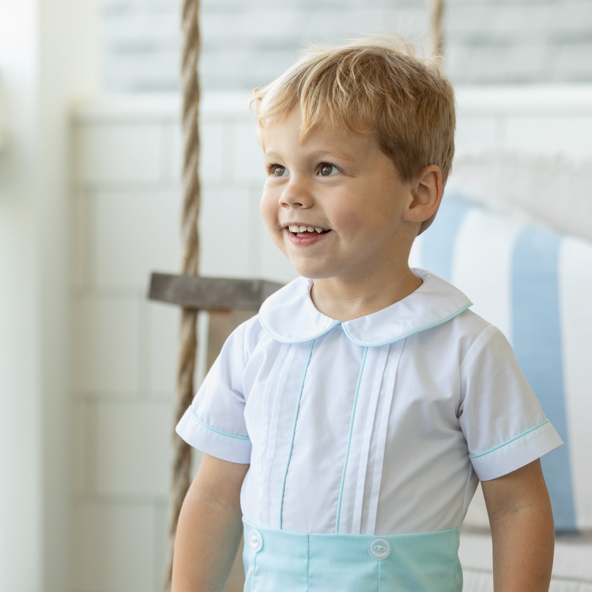 Toddler boy wearing the Henry Duvall Benjamin Button-On, a traditional heirloom-style outfit designed for special occasions and family photos.