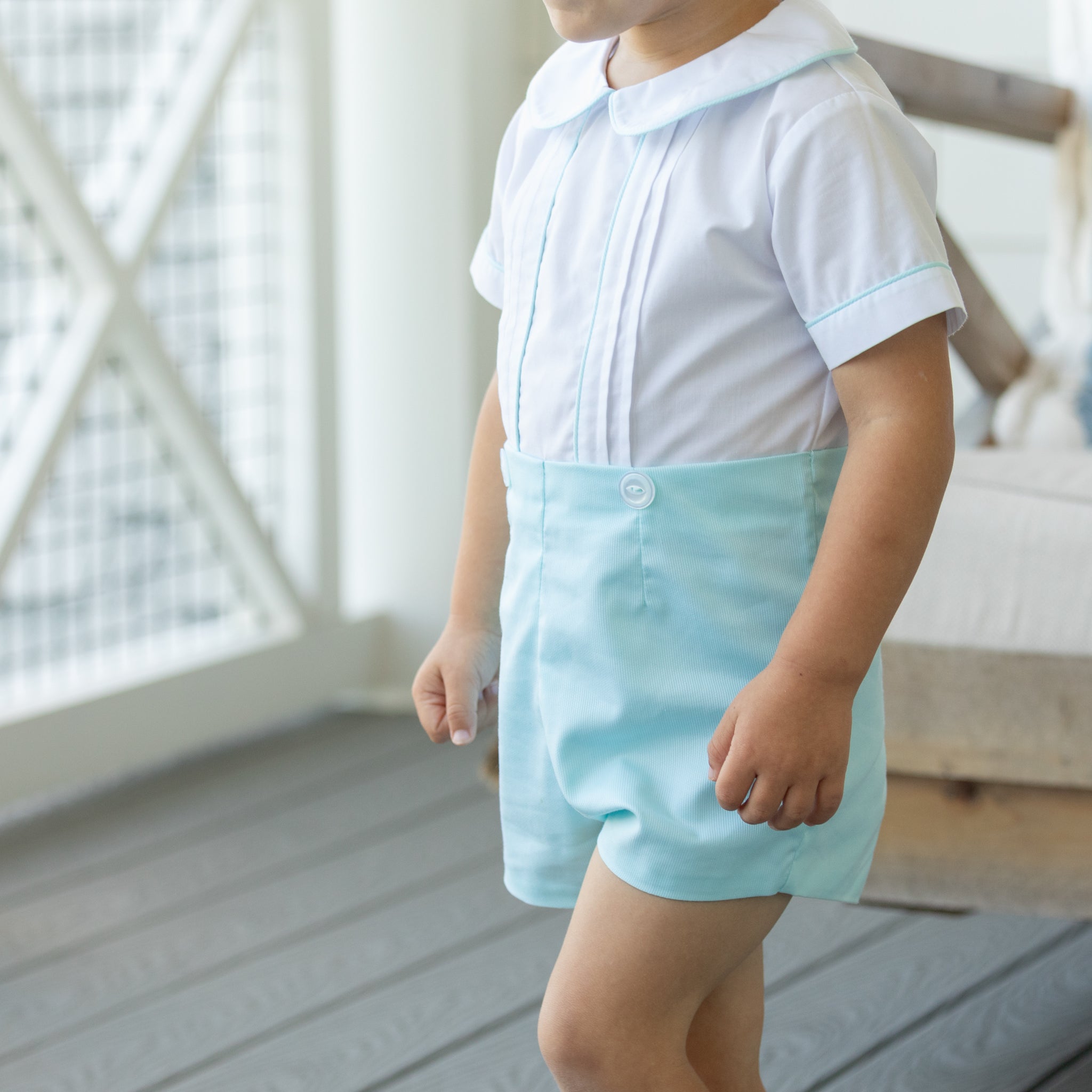 Toddler boy wearing the Henry Duvall Benjamin Button-On, a traditional heirloom-style outfit designed for special occasions and family photos.