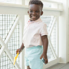 Henry Duvall boys classic polo shirt in Pink Sand, a timeless cotton polo designed for spring and summer wear.