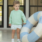 Henry Duvall Somers Shorties for toddler boys in Bailey’s Blue Seersucker, a classic bloomer-style short designed for summer wear.