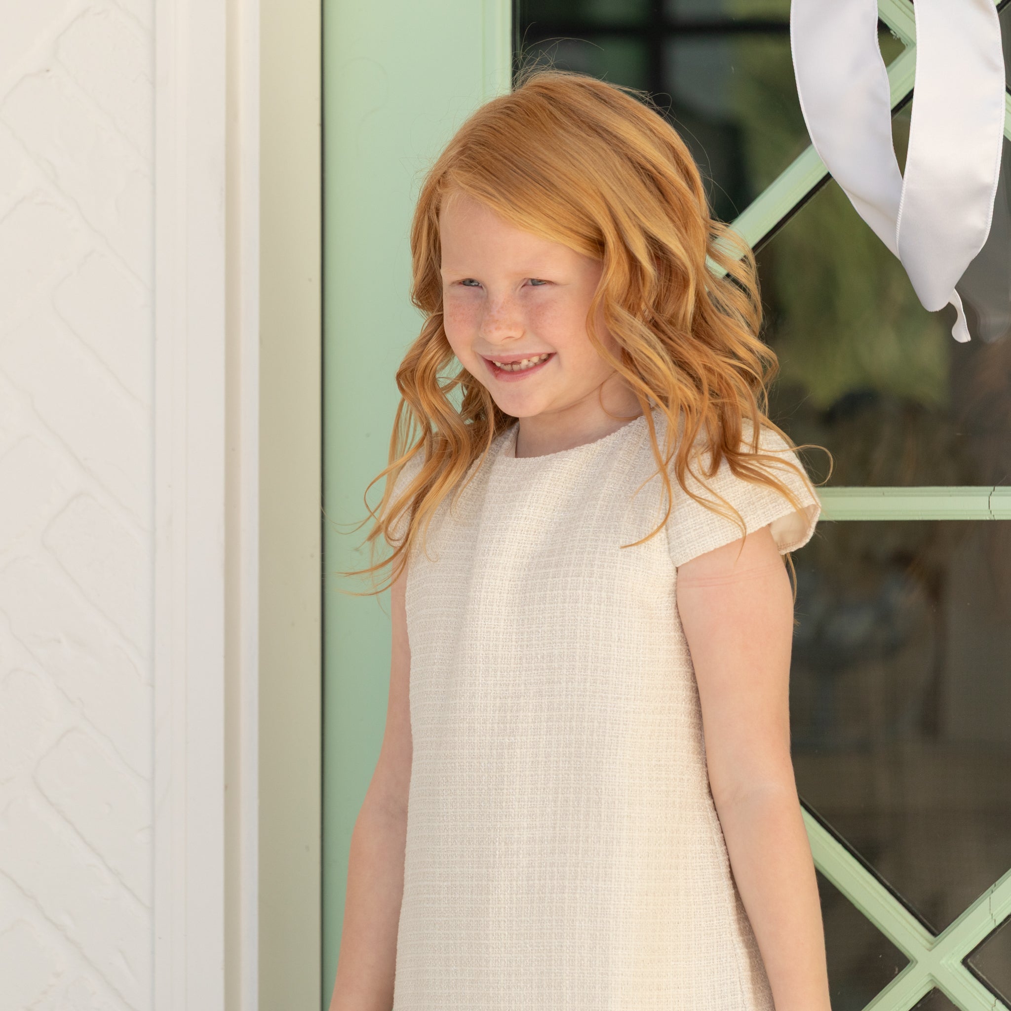 Girl wearing the Henry Duvall Charlotte Dress, a polished older girls dress designed for special occasions and coordinated family looks.