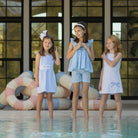 Girl wearing the Henry Duvall Schuyler Dress, a classic girls shift dress designed for summer outings and sibling matching.