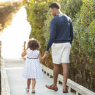 Henry Duvall Betsy Dress in white cotton with navy polka dots and grosgrain bow, classic twirl dress for girls that transitions from summer to fall