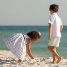 Henry Duvall Betsy Dress in white cotton with navy polka dots and grosgrain bow, classic twirl dress for girls that transitions from summer to fall